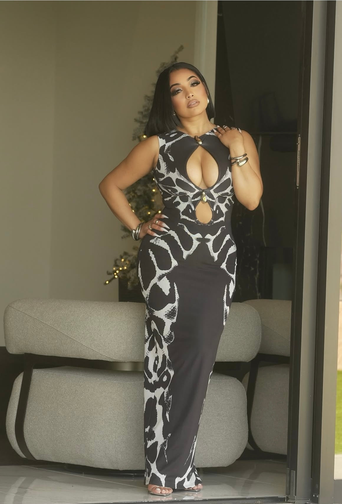 RAINE
Keyhole detail snake maxi dress